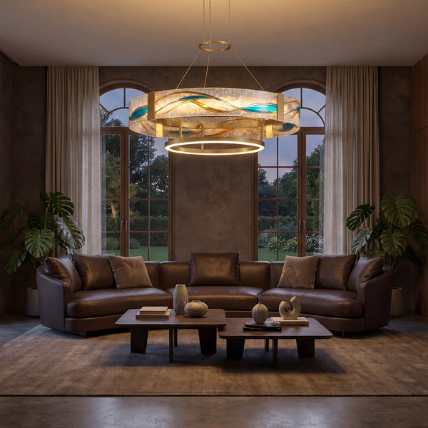 A statement living room chandelier with glass and brass detailing, casting a soft warm glow above the seating area and bringing a polished focal point to the room.
