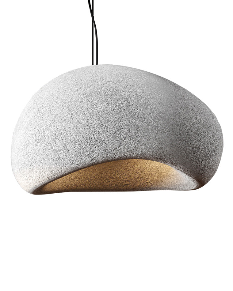 Studio cutout showing one of the white asymmetric resin pendant light fixtures with a softly curved opening.
