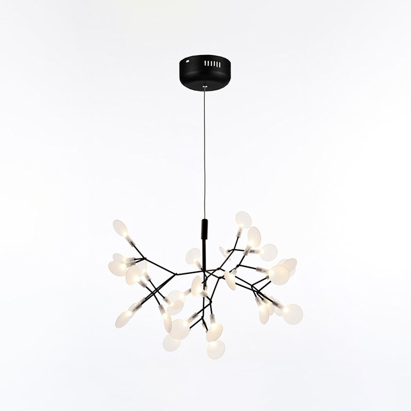 Compact 30-light black Firefly tree branch chandelier, pairing architectural dark branches with softly glowing acrylic leaves.