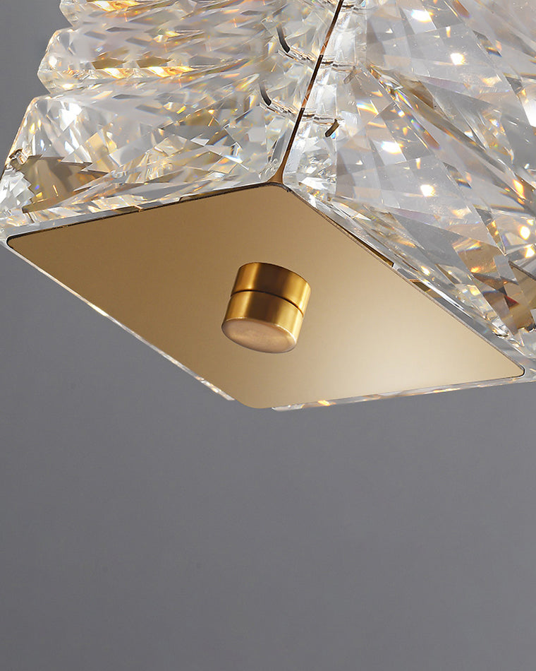 Close-up of the gold end cap and suspension point on the WM2193 gold crystal chandelier, surrounded by faceted crystal pieces.