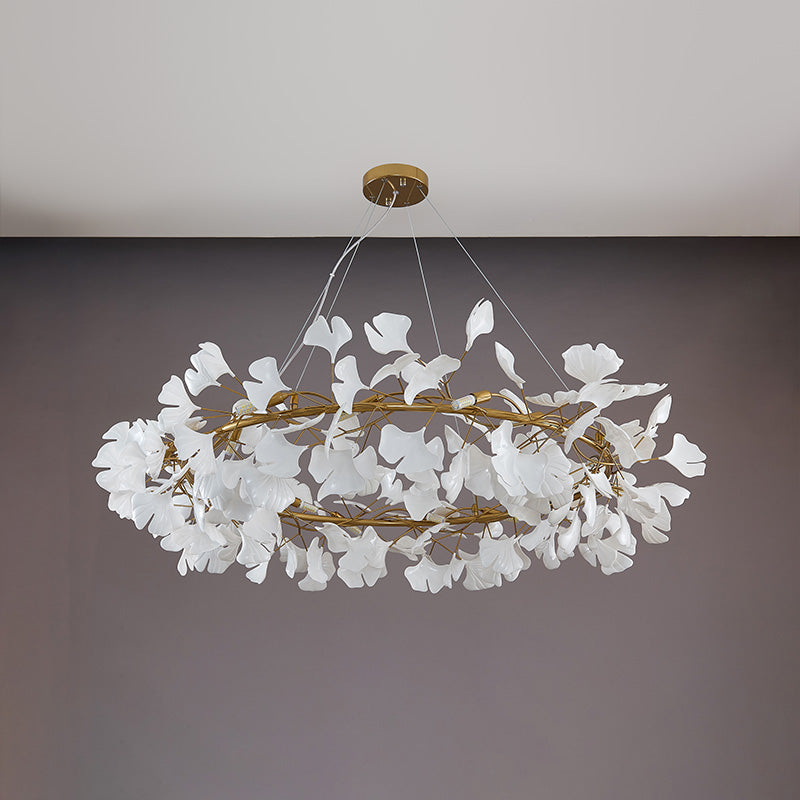 Gold 49-inch large round ceramic leaf chandelier shown unlit.
