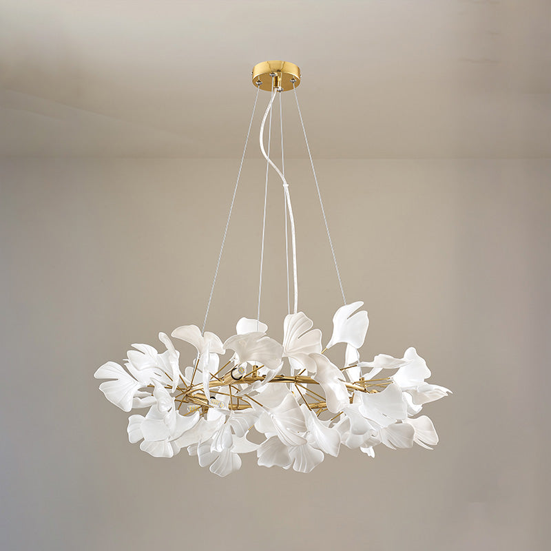 Gold 24-inch round ceramic leaf chandelier shown unlit.