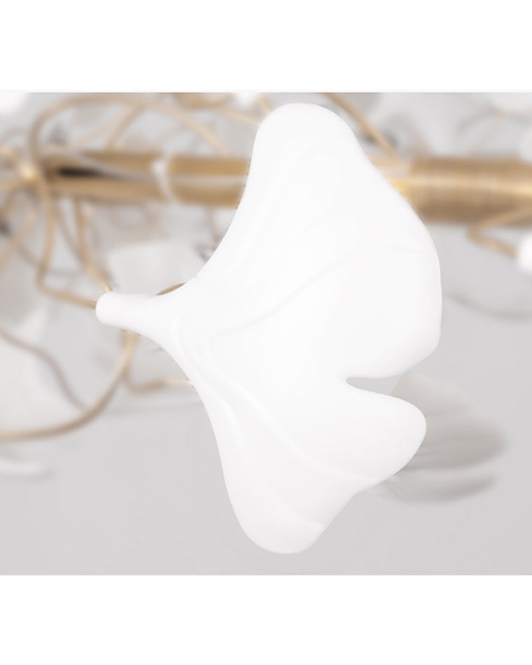 Single sculpted white ceramic ginkgo leaf in close-up, showing the curved form and soft surface used across the WM2419 chandelier.