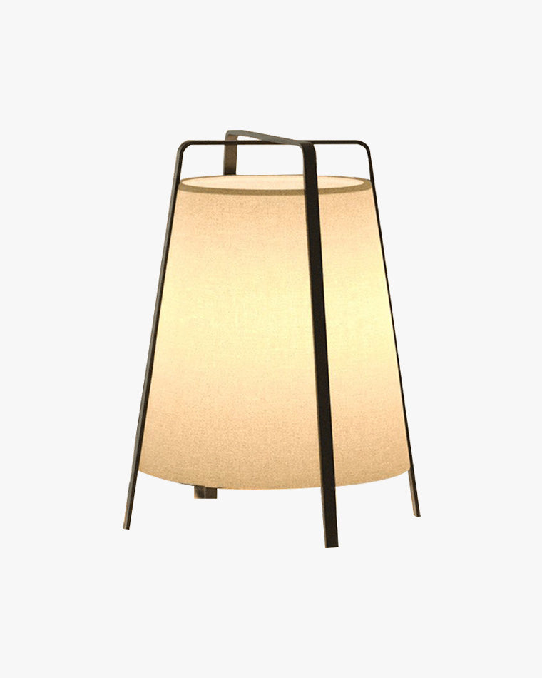 Short beige paper lantern floor lamp with a black metal frame and warm ambient glow.