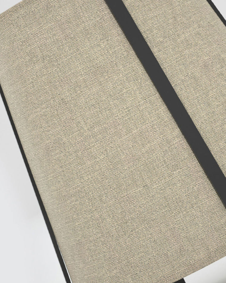 Close-up of the beige paper shade texture framed by slim black metal supports.