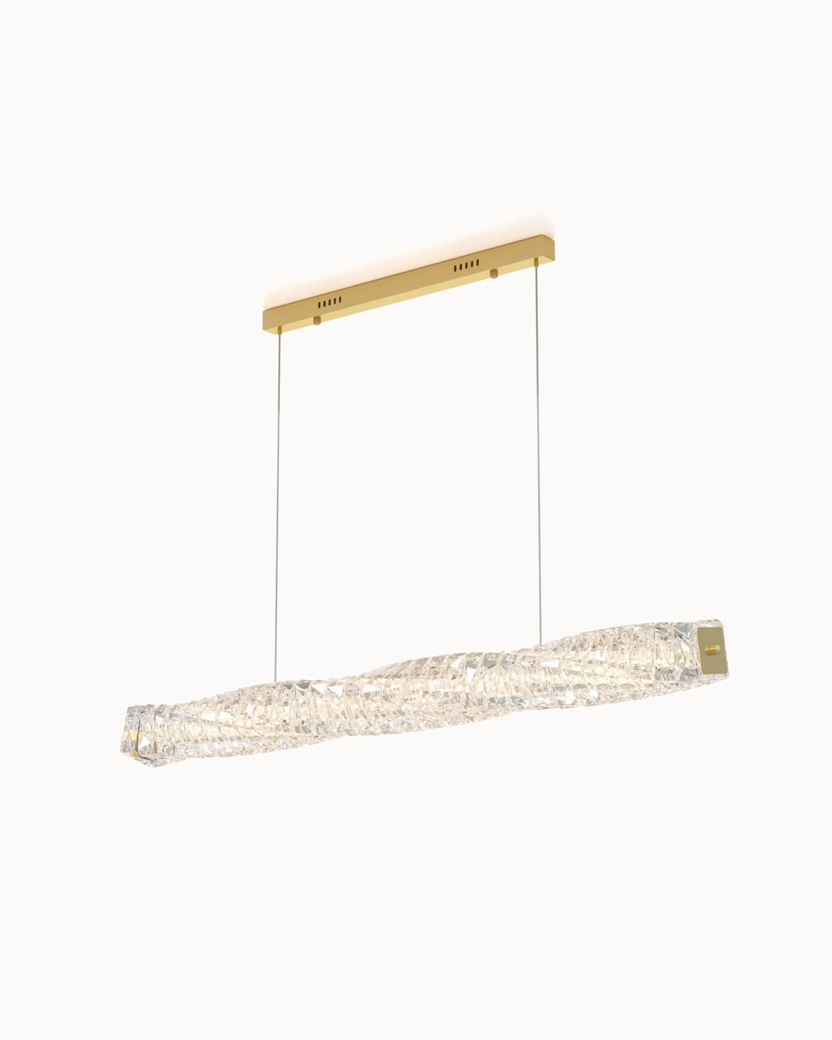WOMO WM2193 linear crystal chandelier in gold, with a sculptural twisted crystal bar, rectangular canopy and two suspension cables on a white background.
