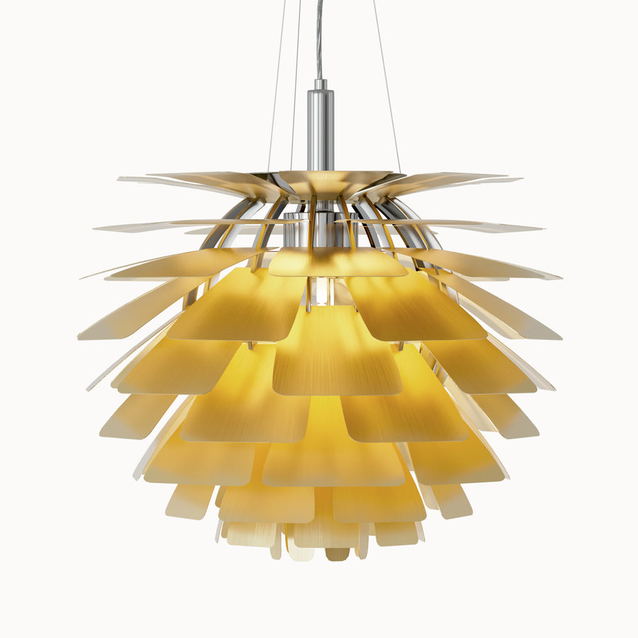 Brass pinecone pendant light with layered metal shades, softly glowing against a clean white background.