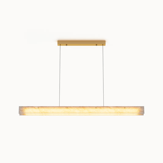 Front view of a glowing alabaster linear chandelier with a gold rectangular canopy and slim suspension cables on a white background.