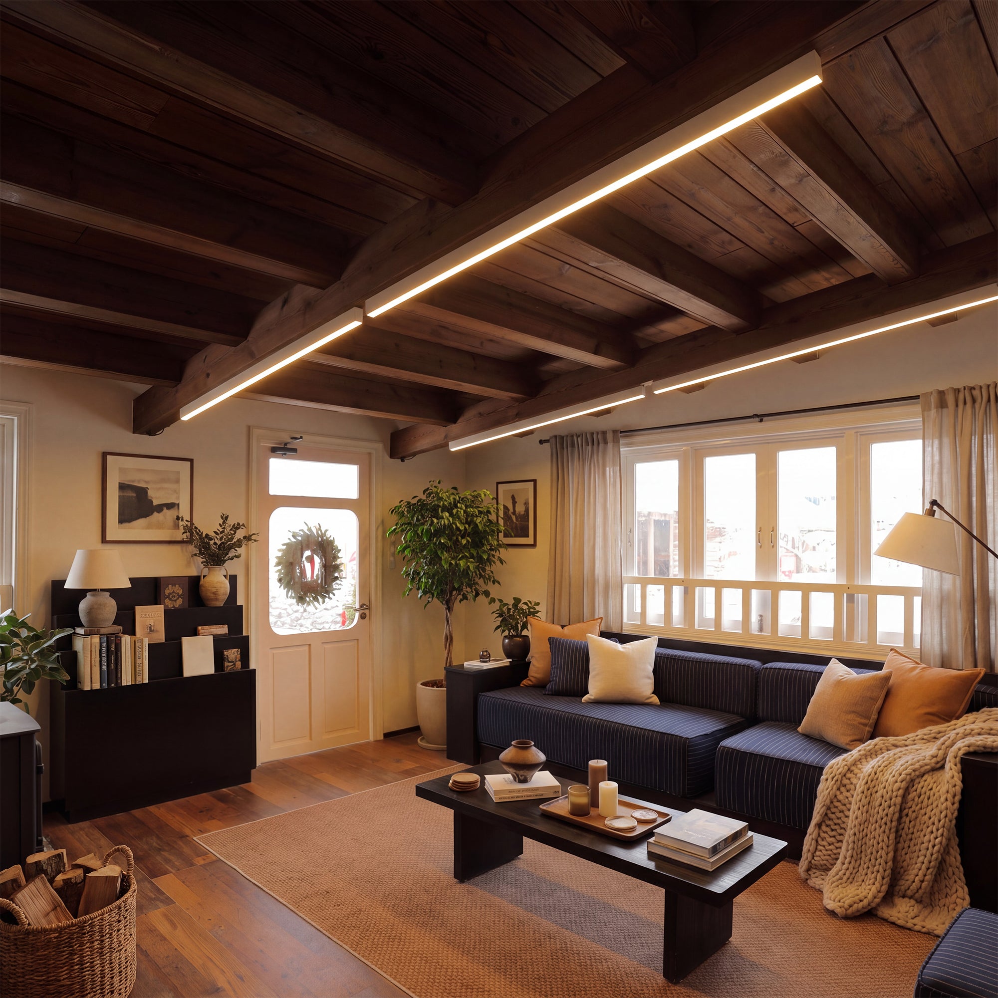 A long linear Modern Ceiling Light mounted across a wood-beamed living room ceiling, emphasizing its extended form and clean contemporary glow.