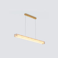 Three-quarter product view of the glowing minimalist chandelier with layered alabaster bars and a gold canopy.