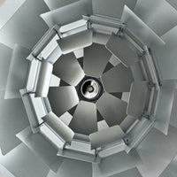 Top view of a layered metal pendant light, revealing the pinecone shade structure and central bulb holder.