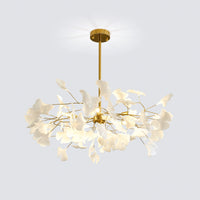 Front view of the glowing pottery leaf chandelier with layered white leaves and gold branches