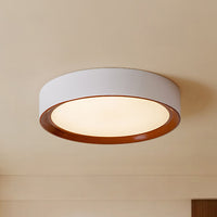Low-angle view of the white and walnut modern ceiling light fixture hugging the ceiling