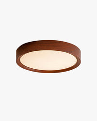 Low-profile walnut round flush mount ceiling light with a white acrylic diffuser, shown on a clean studio background.