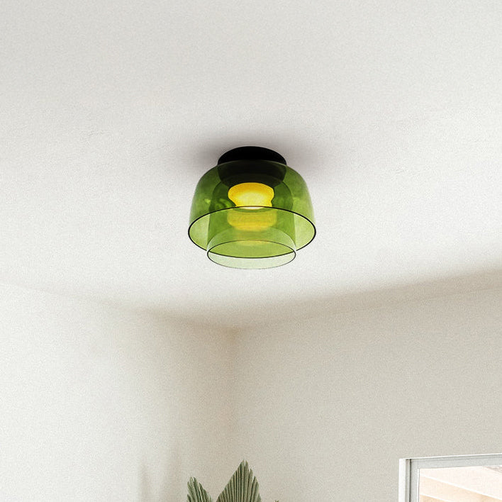 Green two-tier drum flush mount ceiling light with translucent concentric shades on a bright white ceiling.