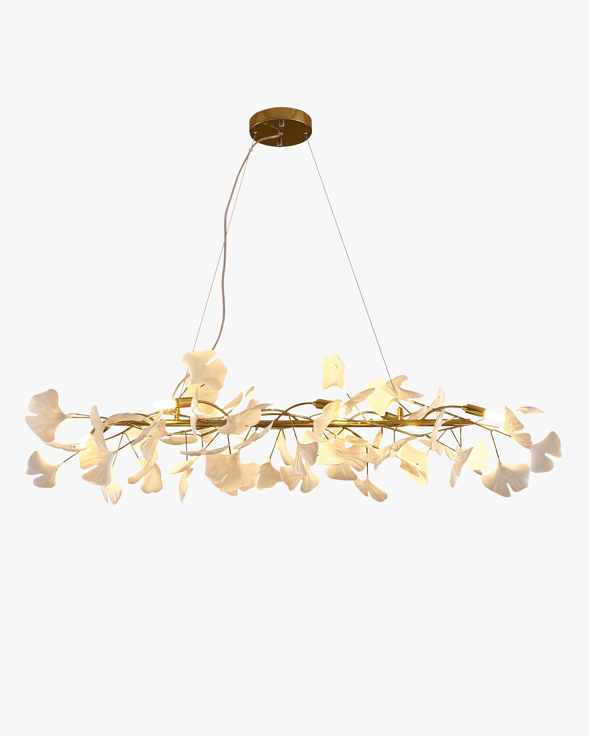 Gold ceramic ginkgo leaf linear chandelier with sculpted white leaves on a white background.