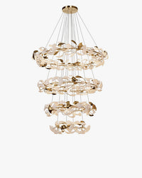 Four-tier gingko chandelier with circular rings of white leaf shades and reflective gold accents.
