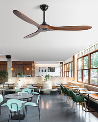 This dark-wood mid century modern ceiling fan echoes the rich window frames and relaxed character of the restaurant below.