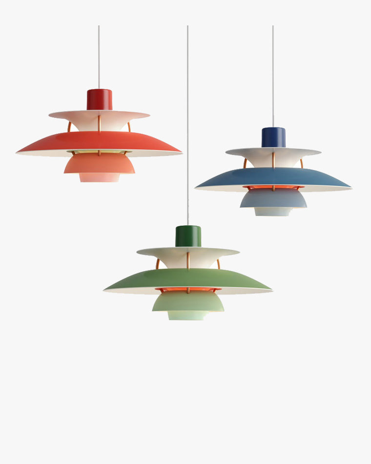Colorful pendant lights with layered shades in red, blue, and green finishes, showcasing a modern Scandinavian-inspired design.