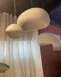 Close-up of three textured resin shades showing their irregular rims and warm, golden interiors.