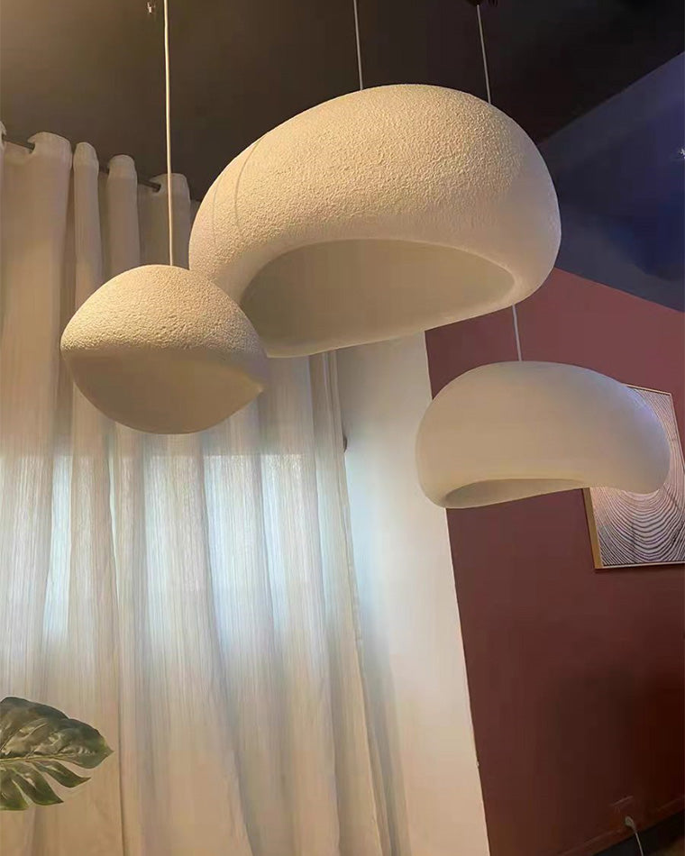 Close-up of three textured resin shades showing their irregular rims and warm, golden interiors.