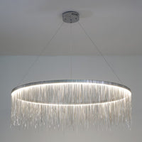 Close view of the illuminated silver 39-inch chandelier, where its broad ring and abundant chain fringe create a commanding yet airy centerpiece.