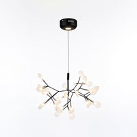 Black 30+1-light Firefly dining light fixture with a glowing canopy, supporting intimate ambience with an additional lighting layer.