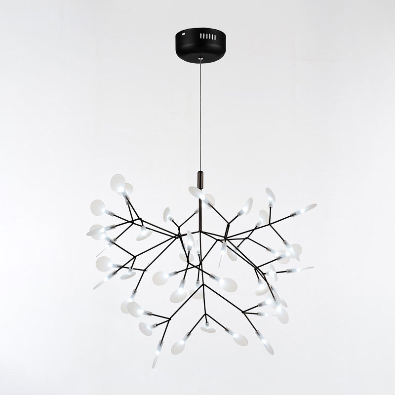 Black 45-light Firefly organic chandelier, creating depth through luminous leaves and sculptural branches instead of heavy ornamentation.