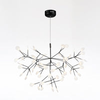 Large 63-light black Firefly tree branch chandelier, spreading across the ceiling like a luminous canopy shaped by nature inspiration.
