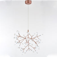 Illuminated 45-light rose-gold Firefly living room chandelier, forming a fuller canopy of light for medium-size interiors.