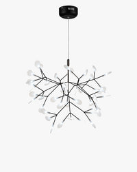 WOMO WM2072 black Heracleum tree branch chandelier, with translucent acrylic leaves resembling fireflies resting across an airy sculptural canopy.