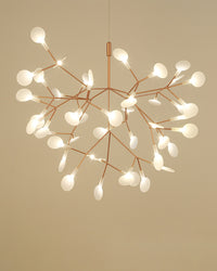 Medium rose-gold Heracleum tree branch chandelier, balancing a generous firefly canopy with an elegant and uncluttered profile.