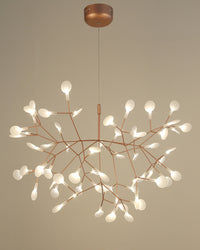 Large rose-gold Firefly chandelier with an expansive branching form, designed to give spacious interiors a fuller and more balanced luminous presence.