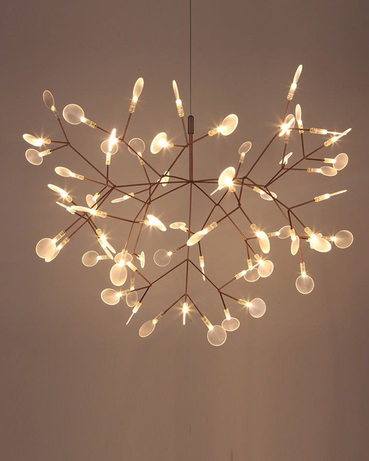 Illuminated rose-gold Firefly organic chandelier seen from below, revealing a layered constellation of branches and softly diffused leaves.