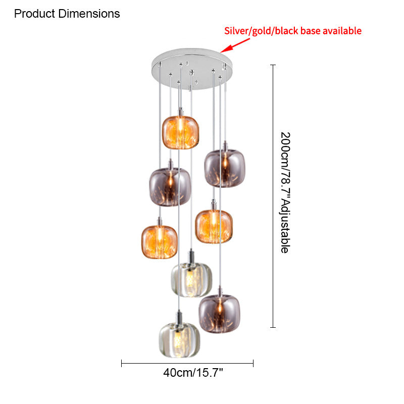Eight-light waterfall glass chandelier balancing amber, smoked, and clear pendants in a medium-height cascading arrangement.