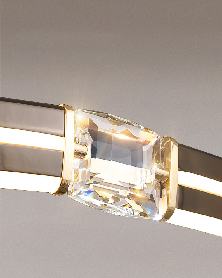 Square crystal insert refracting light between the black rails, giving the minimalist crystal chandelier a single jewelry-like highlight.