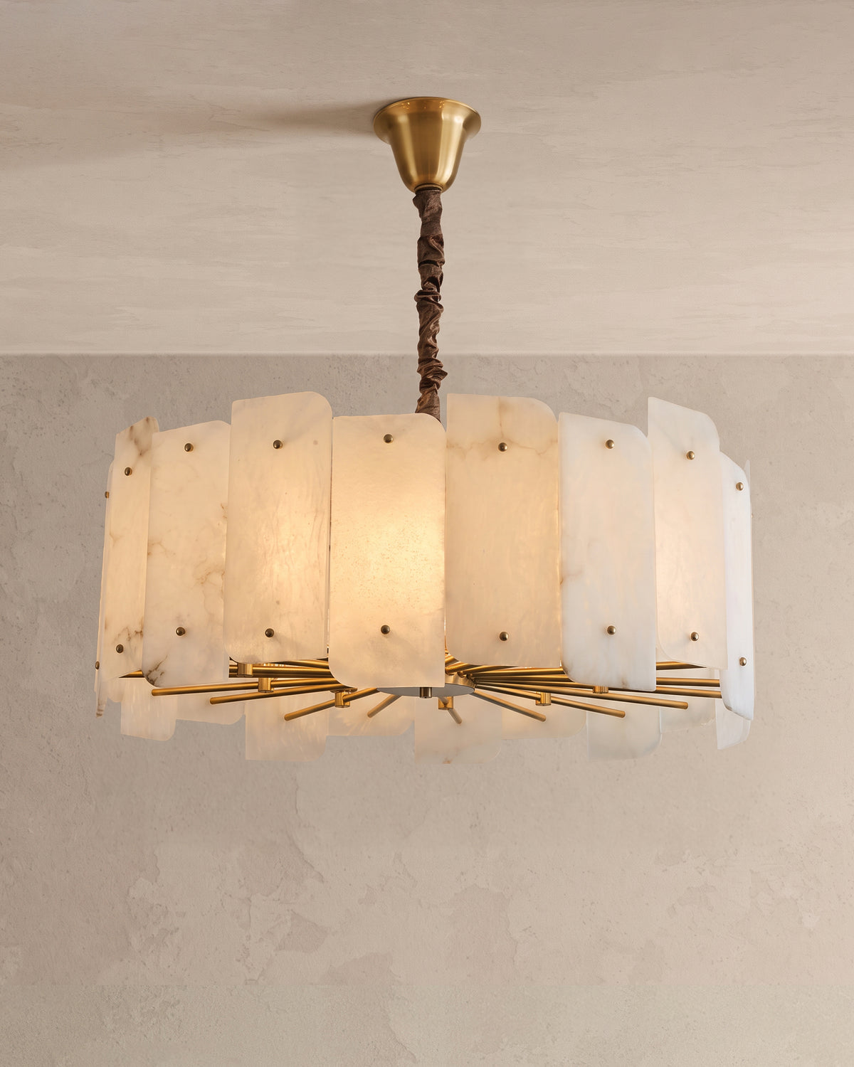 WOMO WM2391 chandelier with upright alabaster panels, gold-toned rods underneath and a dark covered suspension.