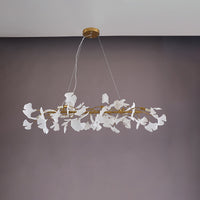 Gold 59-inch ceramic ginkgo leaf linear chandelier shown unlit.