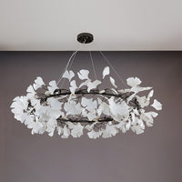 Black 59-inch extra-large round ceramic leaf chandelier shown unlit.