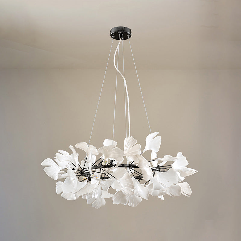Black 24-inch round ceramic leaf chandelier shown unlit.