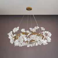 Gold 39-inch round ceramic leaf chandelier shown unlit.