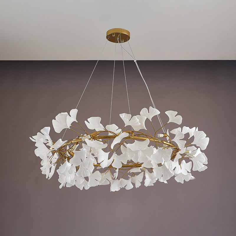 Gold 39-inch round ceramic leaf chandelier shown unlit.