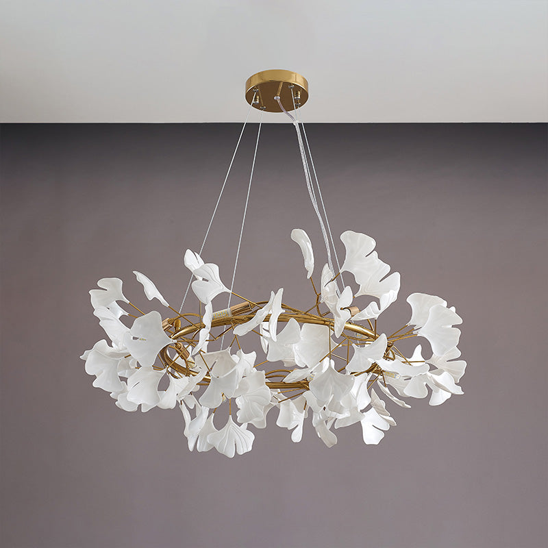 Gold 31-inch round ceramic leaf chandelier shown unlit.
