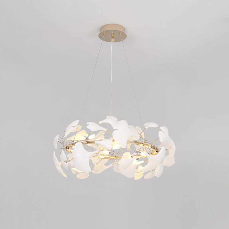Ø22-inch WM2419 ceramic leaf chandelier against a light background, showing its compact round profile and layered white leaves.