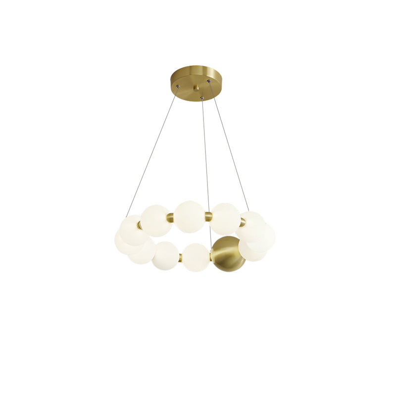 Compact 18-inch pearl-ring chandelier combines integrated LED globes with a gold accent, preserving its jewelry-like elegance at a smaller scale.