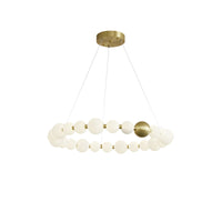 The 33-inch chandelier creates a broad, uninterrupted circle of pearl-like light, balancing statement size with an open suspended silhouette.