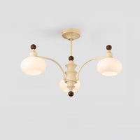 Three-light beige dome glass chandelier on a light background