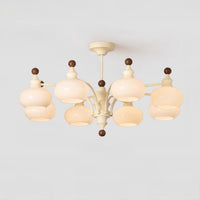Eight-light beige dome glass chandelier on a light background