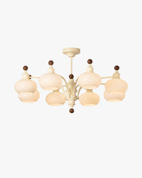 WOMO dome glass chandelier in beige with eight layered glass globes on a light background