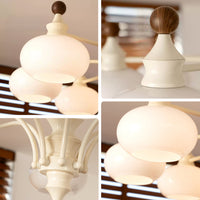 Close-up of the chandelier’s layered glass globes, curved arms, and central stem details